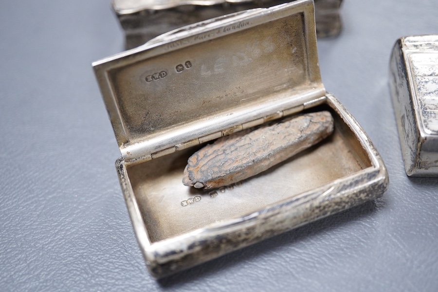 A Victorian silver ovoid snuff box, Henry William Dee, London, 1874, 58mm, together with two George V silver snuff boxes.